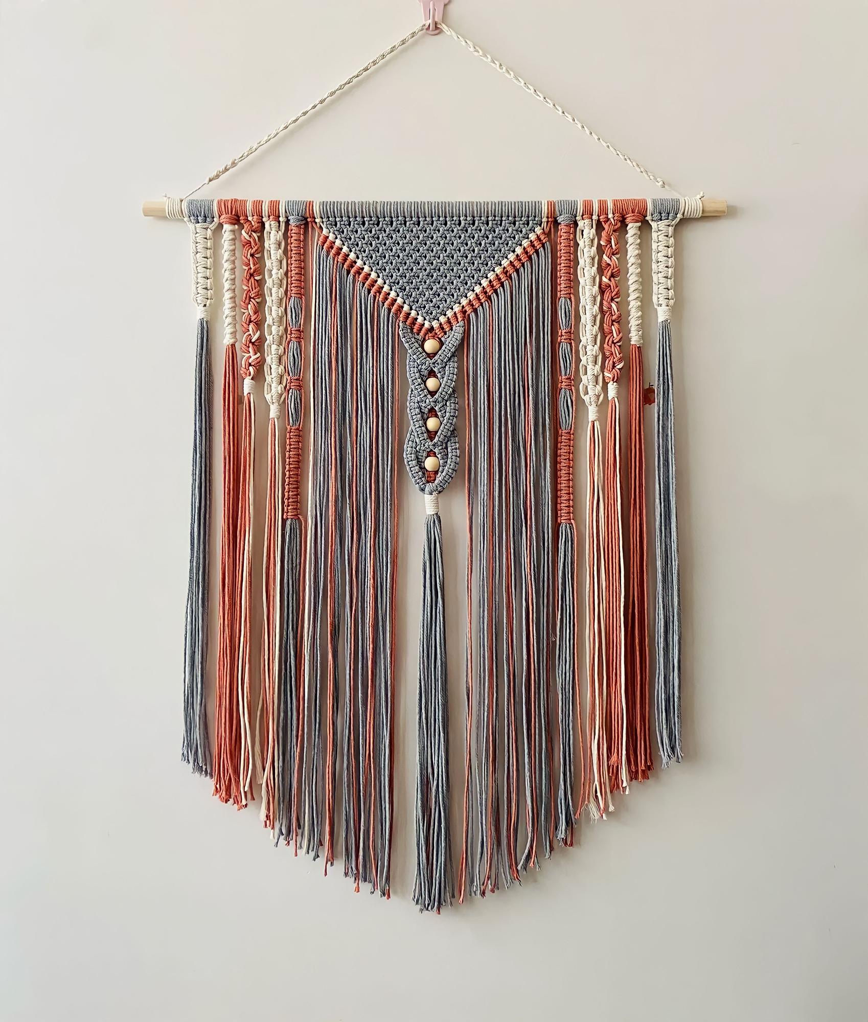 bright studio doorway with embroidered samples hanging