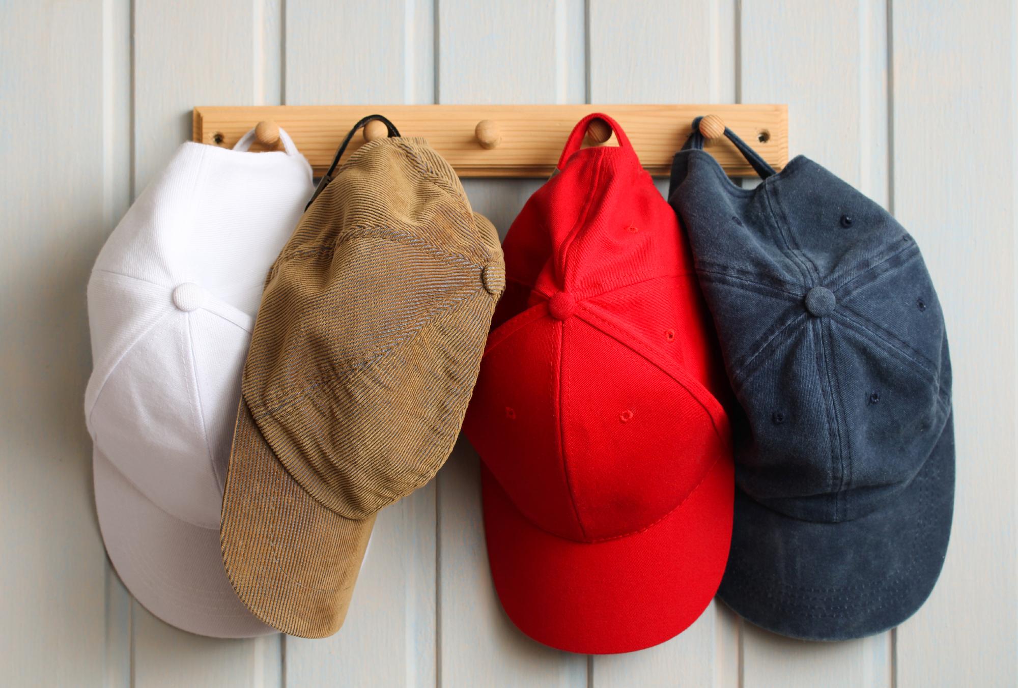 stack of embroidered caps in studio light